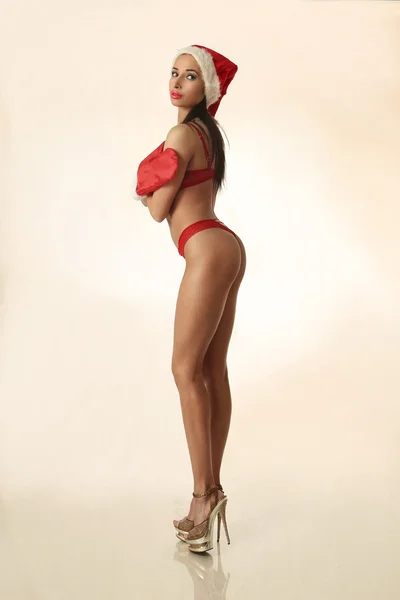 Athletic sexy brunette wearing santa — Stock Photo, Image