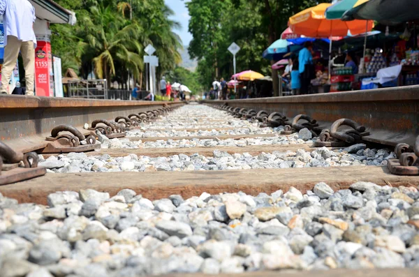 Market fair beside Railway train go to Bridge over the River Kwa — Stock Photo, Image