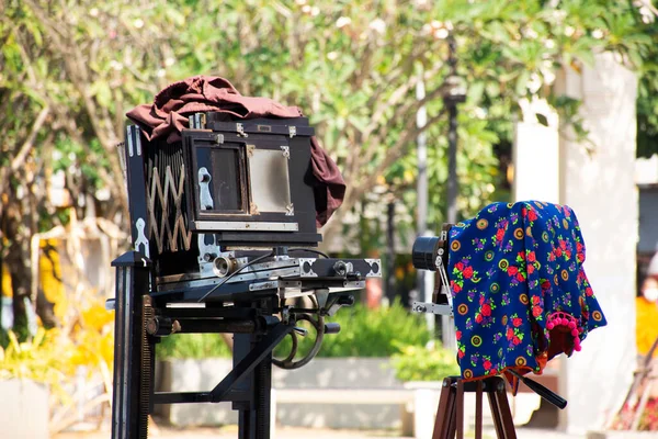 Antique cameras and Camera tripod for show and thai people and foreign travelers take photo in event Chiang Mai Design Week festival at Lanna Folklife Museum and Dreamer Square in Chiang Mai, Thailand