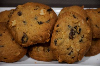 Thai bakery cereal cookies chocolate chip recipe serve on white ceramic dish plate in dessert sweet bake shop at Nonthaburi, Thailand