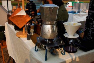 Tools equipment and material for thai men barista people use drip coffee maker or dripper made hot and iced coffee and tea for sale at outdoor of cafe shop at Bangbuathong city in Nonthaburi, Thailand