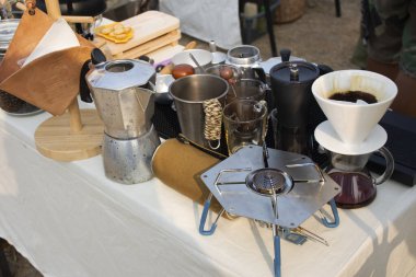 Tools equipment and material for thai men barista people use drip coffee maker or dripper made hot and iced coffee and tea for sale at outdoor of cafe shop at Bangbuathong city in Nonthaburi, Thailand