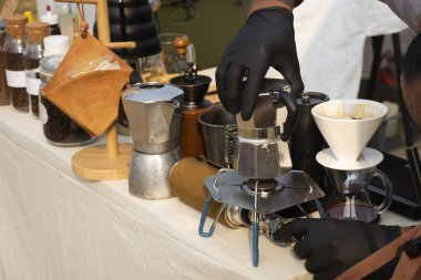 Tools equipment and material for thai men barista people use drip coffee maker or dripper made hot and iced coffee and tea for sale at outdoor of cafe shop at Bangbuathong city in Nonthaburi, Thailand
