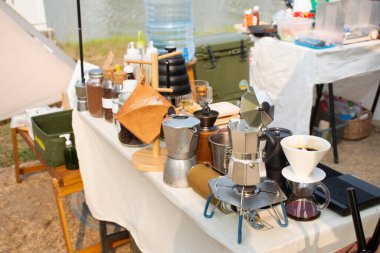 Tools equipment and material for thai men barista people use drip coffee maker or dripper made hot and iced coffee and tea for sale at outdoor of cafe shop at Bangbuathong city in Nonthaburi, Thailand