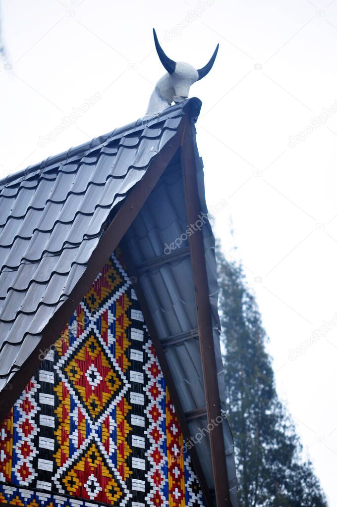 Ancient antique vintage retro roof of traditional house of Tirto Meciho Karo for Indonesian people foreign traveler travel visit in Karna city at Sumatera Utara or North Sumatra, Indonesia