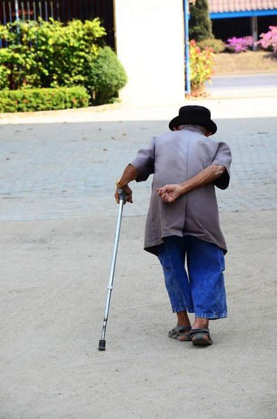 Old man walking at Wat Khua Khrae Temple in Chiang Rai, Thailand. — Stock Image Old man walking at Wat Khua Khrae Temple in Chiang Rai, Thailand. Stock Photo