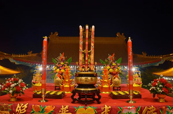 Sacrificial offering or oblation with joss stick and candle — Stock Photo, Image