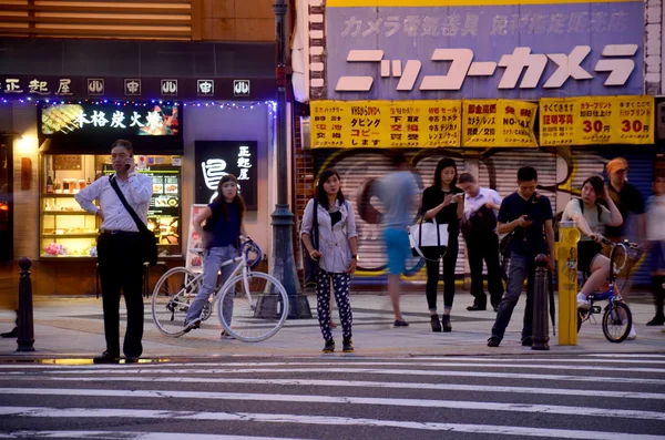 Motion blurred of people walk cross over road at crosswalk — Stock Photo, Image