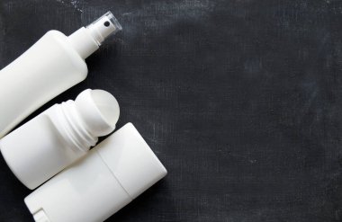 Set with different cosmetic products on light background