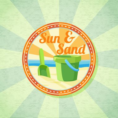 Güneş, kum, maça ve kova