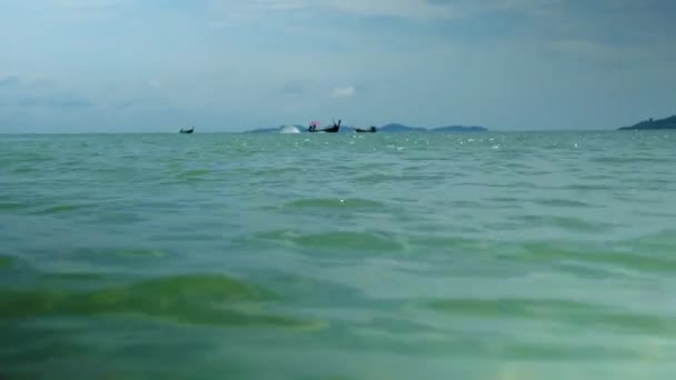 Close Shot Water Turquoise Sea Waves Showing Fishing Boat Sail — Stok Video