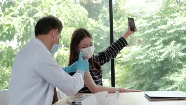 Asian Woman Taking Selfie Portrait Mobile Phone While Doctor Vaccinating — Stock Video