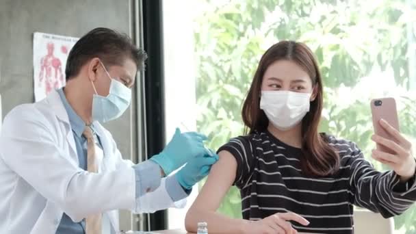 Asian Woman Taking Selfie Portrait Mobile Phone While Doctor Vaccinating — Stock Video