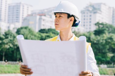 Asyalı inşaat mühendisleri bölgede deneysel testler yapıyorlar.