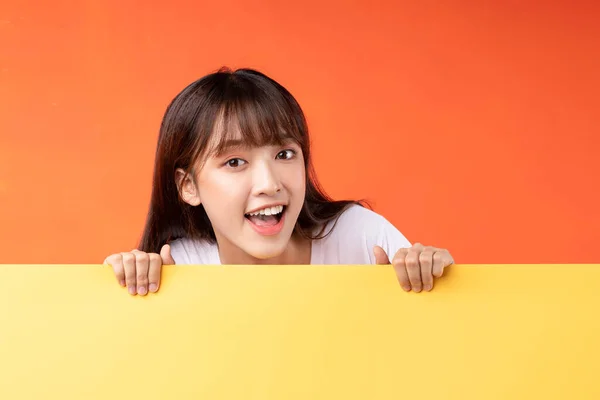 Young Asian Girl Overlapping Yellow Background Orange Background — ストック写真