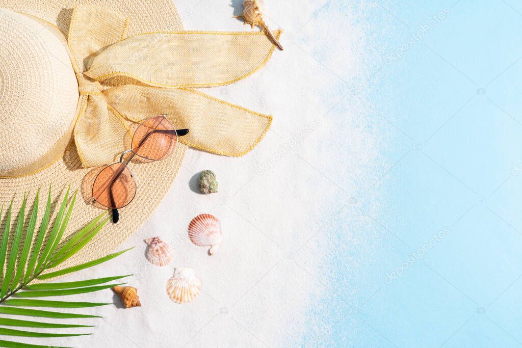 Summer background with hat, sunglasses, sand and seashell