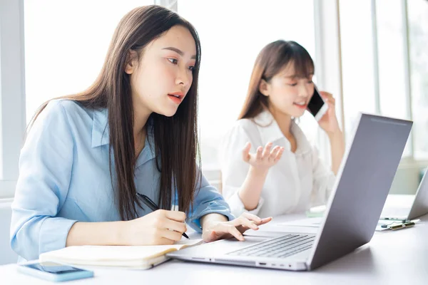 Young Asian woman focusing on getting work done
