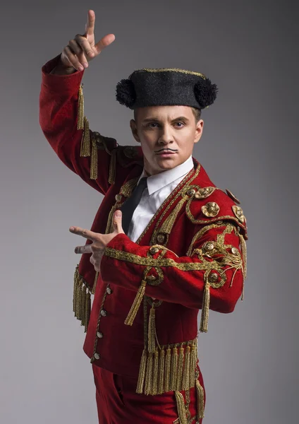 Studio shot of man dressed as Spanish matador — Stock Photo, Image