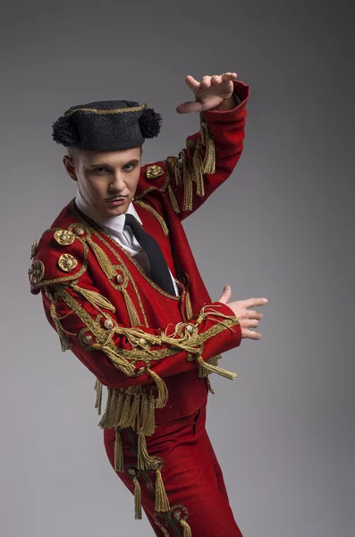 Studio shot of man dressed as Spanish matador Royalty Free Stock Images