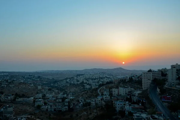 Dawn over Bethlehem. The city in which Jesus Christ was born. The sun from the cloud rises over the ancient city