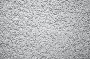 Evin engebeli beton duvarı. Ultimate Gray 'de tonlama, trend 2021. Kapalı alan, duvar dokusu.