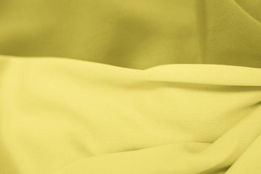 Karanlık ve aydınlık kumaştan güzel bir arka plan, seçici bir odak. Yatay fotoğraf tonlama aydınlatma, eğilim 2021.