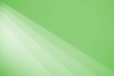 Güzel, parlak bir arka plan. Odanın duvarındaki tavandaki lambadan gelen ışık huzmeleri. Açık ve koyu keskin zıt geçişler.