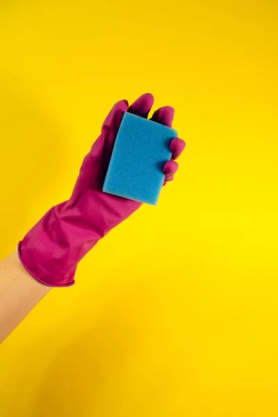 Hand Pink Rubber Glove Holds Blue Sponge Yellow Background House — Stock Photo, Image