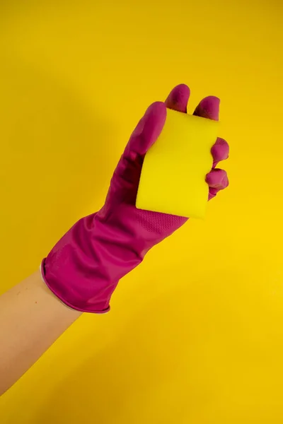 Hand Pink Rubber Glove Holds Yellow Sponge Yellow Background Cleaning — Stock Photo, Image