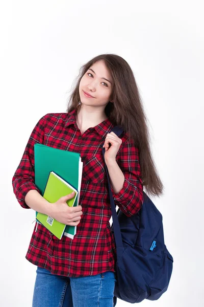 Hermosa colegiala chica, estudiante con libros de texto y mochila . Fotos de stock