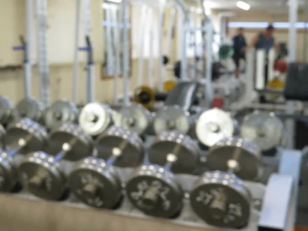 Imagen borrosa abstracta del gimnasio deportivo interior para fitness con fondo bokeh —  Fotos de Stock