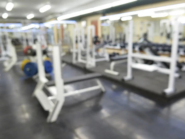 Imagen borrosa abstracta del gimnasio deportivo interior para fitness con fondo bokeh —  Fotos de Stock