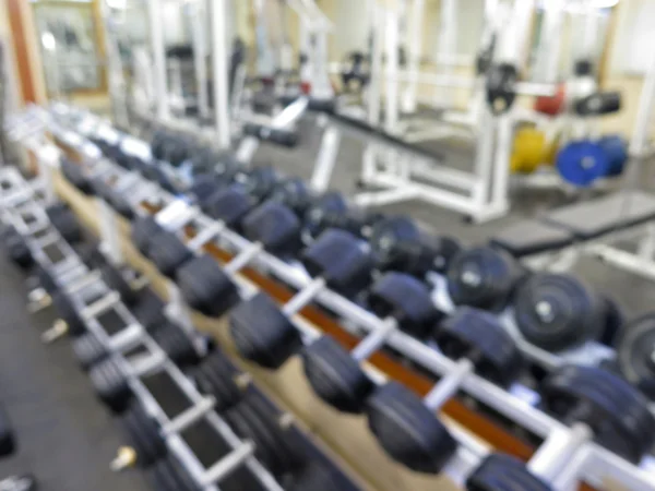 Imagen borrosa abstracta del gimnasio deportivo interior para fitness con fondo bokeh —  Fotos de Stock