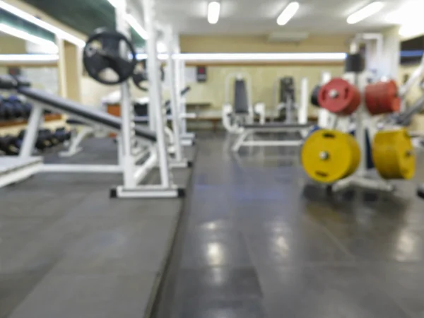 Imagen borrosa abstracta del gimnasio deportivo interior para fitness con fondo bokeh —  Fotos de Stock