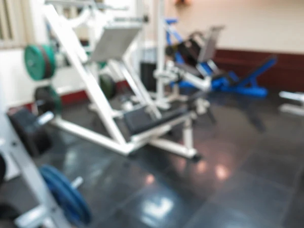 Imagen borrosa abstracta del gimnasio deportivo interior para fitness con fondo bokeh —  Fotos de Stock