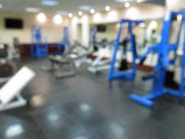 Imagen borrosa abstracta del gimnasio deportivo interior para fitness con fondo bokeh —  Fotos de Stock