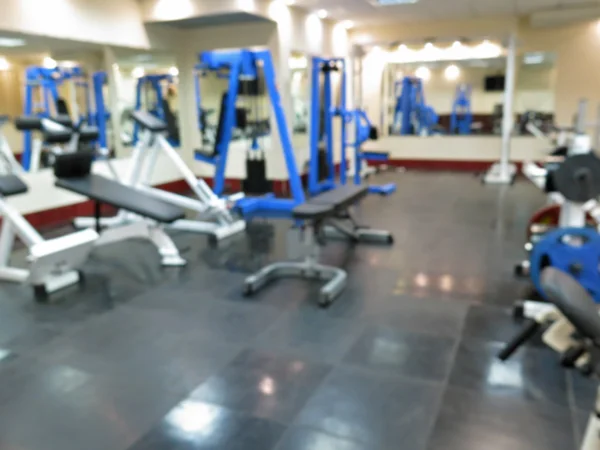 Imagen borrosa abstracta del gimnasio deportivo interior para fitness con fondo bokeh —  Fotos de Stock