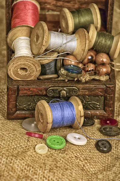 Sewing thread needle button pins, stylized image of an old, tone — 스톡 사진