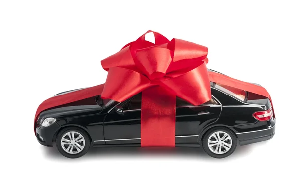 Black car with a red bow — Stock Photo, Image