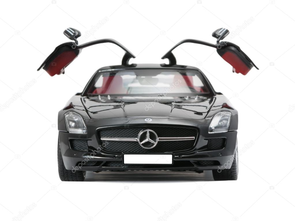 ALMATY, KAZAKHSTAN - june 22, 2014 - Collectible toy car Mercedes-Benz SLS Sedan with open doors isolated on white background