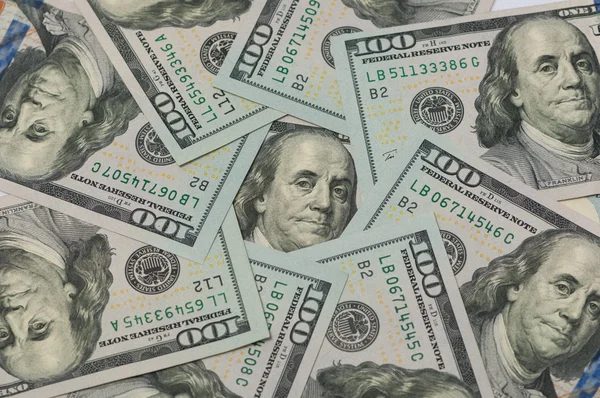 One hundred dollars in a circle — Stock Photo, Image