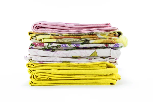 A stack of colorful pillowcases over a white background — Stock Photo, Image