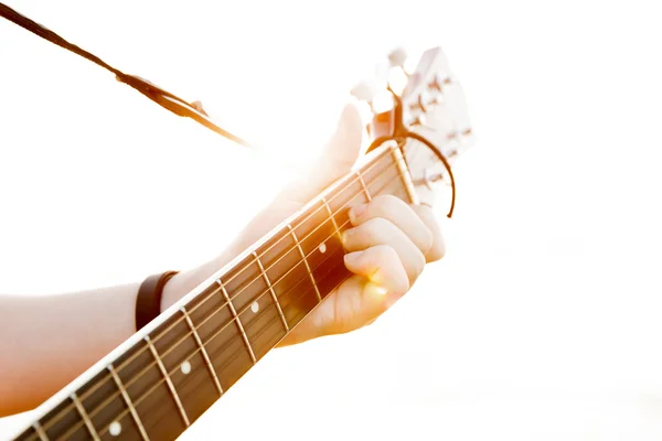 The young guy playing guitar in high-key(soft focus) — Stock Photo, Image