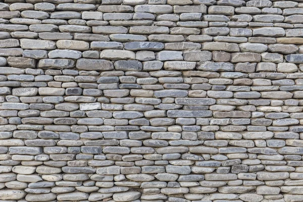Die Mauer aus Flusssteinen — Stockfoto