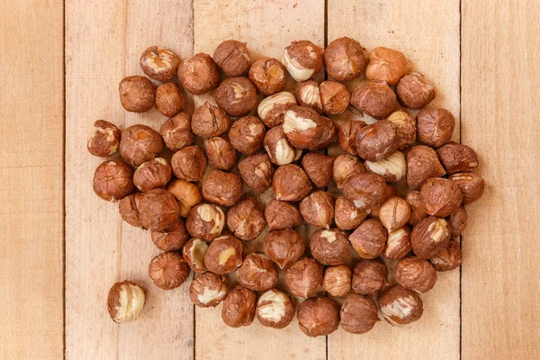 Peeled nuts on wooden boards — Stock Photo, Image