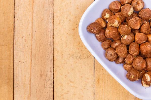 Peeled nuts in ceramic ware — Stock Photo, Image