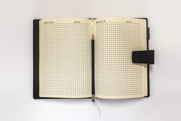 Diary and pensil on a white background — Stock Photo, Image