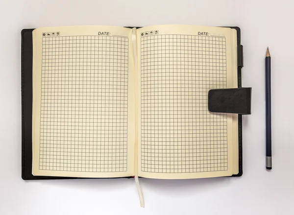 Diary and pencil on a white background — Stock Photo, Image