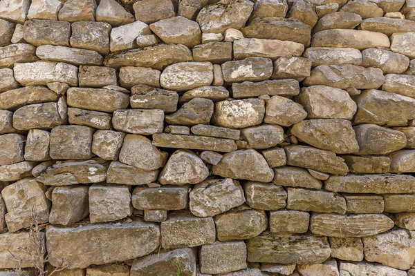 Muur van het huis bekleed met stenen — Stockfoto