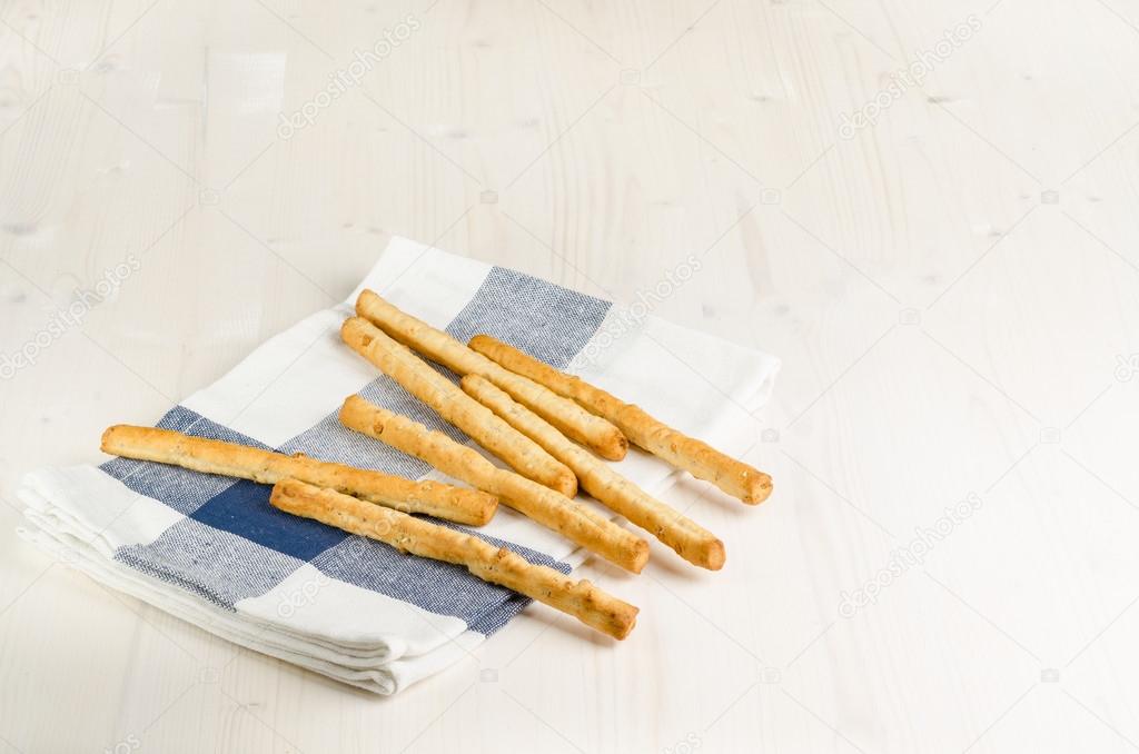 rustic breadsticks  on wood table, close up, background